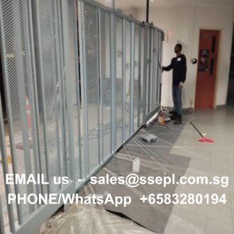 Construction worker stands by glass locker panels in a hallway; overlay text shows contact: sales@ssepl.com.sg, +65 8328 0194.