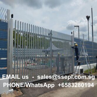 Construction site with a tall metal gate and a worker on a ladder; contact sales@ssepl.com.sg, +65 83280194.